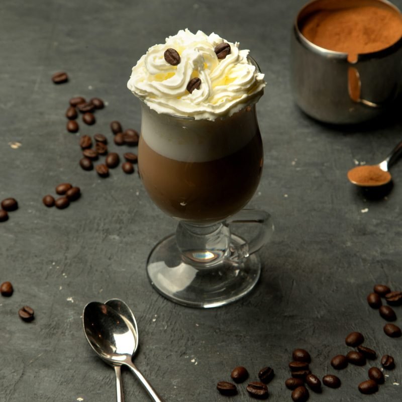 aromatic coffee in a glass cup with whipped cream aromatic coffee in a glass cup with whipped cream