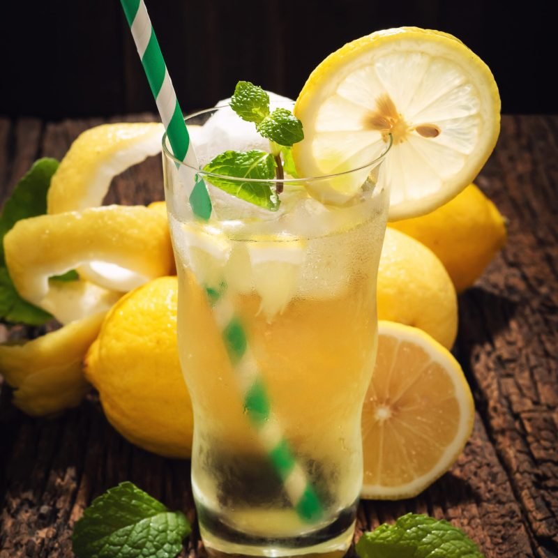 Still Life Glass of Lemonade Soft Drink Lemon Juice on Wooden Ta Still Life Glass of Lemonade Soft Drink Lemon Juice on Wooden Table Refreshment Drink in Summer